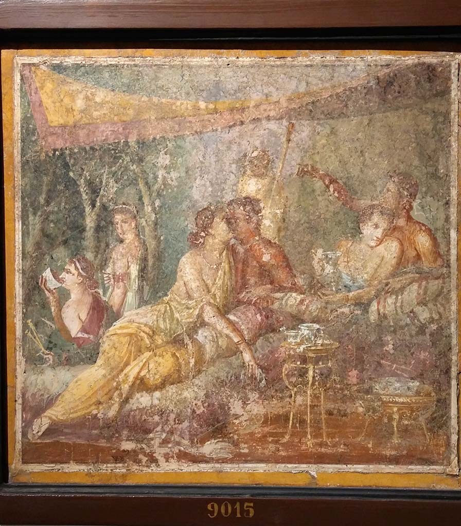 I.3.18 Pompeii. Wall painting of a banquet scene with couple kissing